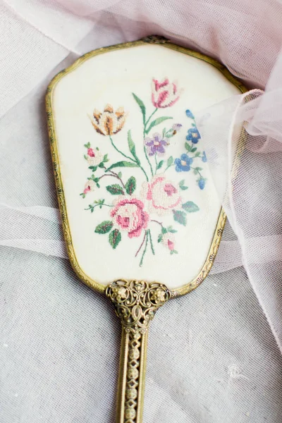 Vintage hand mirror and hairbrush
