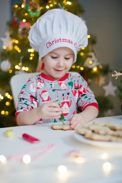 Cute Toddler Boy Decorates Christmas Cookies Colorful Icing White Table — Stock Photo, Image