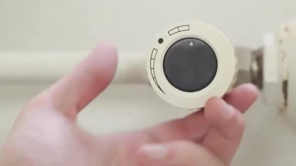 Radiator thermostat, selective focus, white background, turned down to minimum 1 — Stockvideo