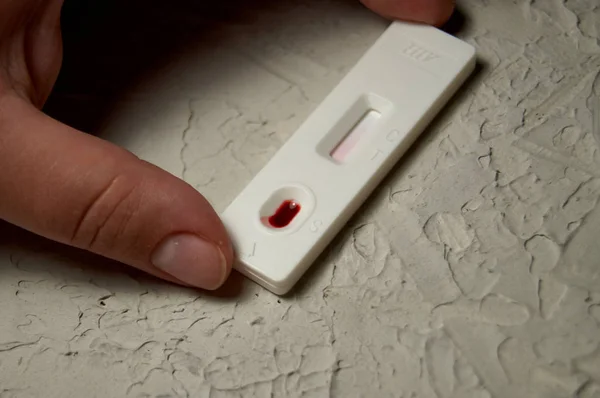 HIV self-test with a drop of blood. Hiv test express.