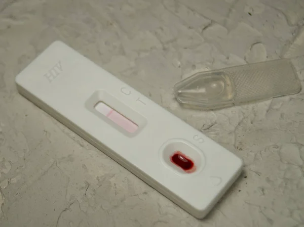 HIV self-test with a drop of blood. Hiv test express.