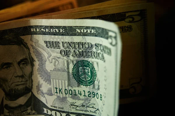 Close up photo of 5, 10 dollar banknotes. United states cash