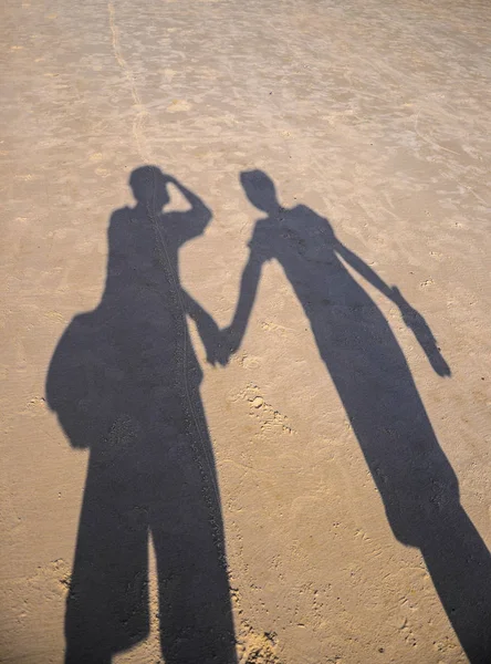 couple shadow on the beach