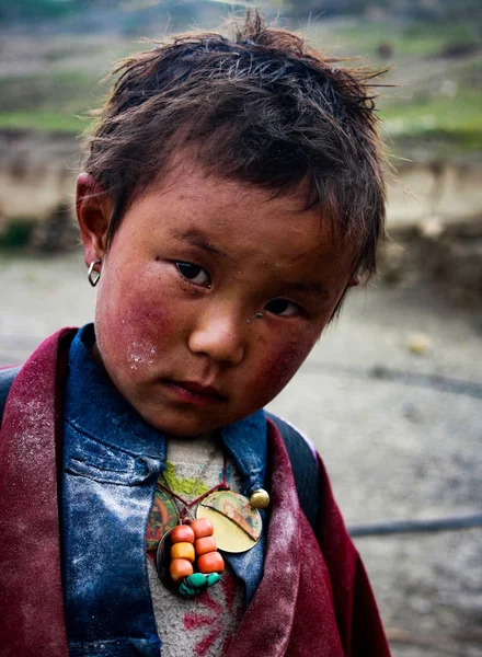 Dolpa is located at a western remote part of Nepal. The people living there are of Tibetian origin. Due to the extremely cold climate, the life in Upper Dolpa is hard and schooling is also rare. I met this child in Saldang, returning from school.