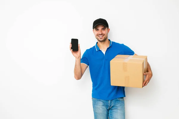 New App Delivery Young Delivery Man Standing His Cardbox Hands — Stock Photo, Image