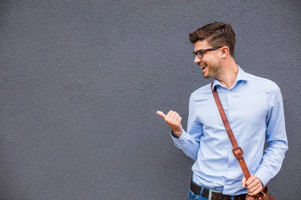 Pointing Empty Side Handsome Smart Casual Man Eyeglasses Leather Bag — Stock Photo, Image