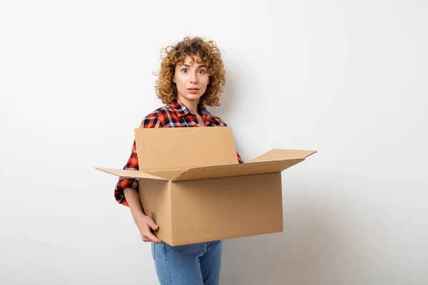 Surprised Young Curly Woman Checkered Shirt Standing Empty Wall Some — Stock Photo, Image