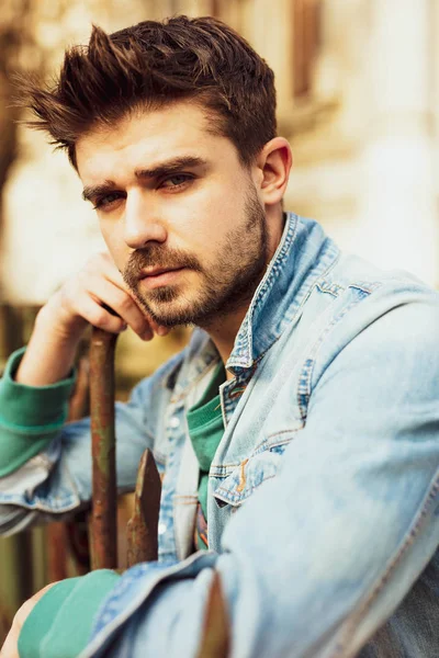 Handsome Guy Jeans Jacket Standing Metal Fence — Stock Photo, Image