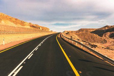 car road on a desert landscape clipart