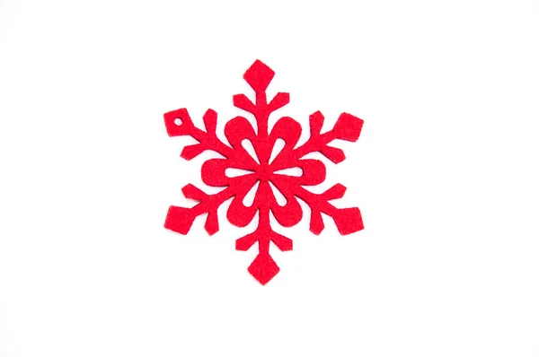 Beyaz zemin üzerine kırmızı yapay Noel snowlake