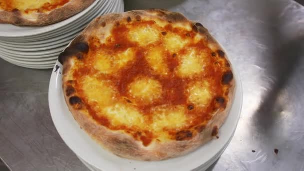 Man Puts Leaf Mint Middle Pizza Crispy Crust Lying Pile — Stock Video