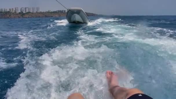 Man Shakes His Legs Water While Sitting Floating Boat Spray — Stock Video