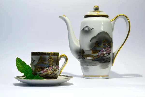Traditional Japanese cup of tea and tea pot