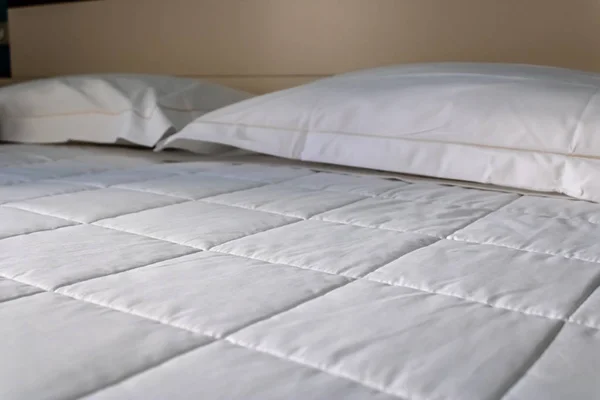 White bedding sheets in the hotel room closeup - Image