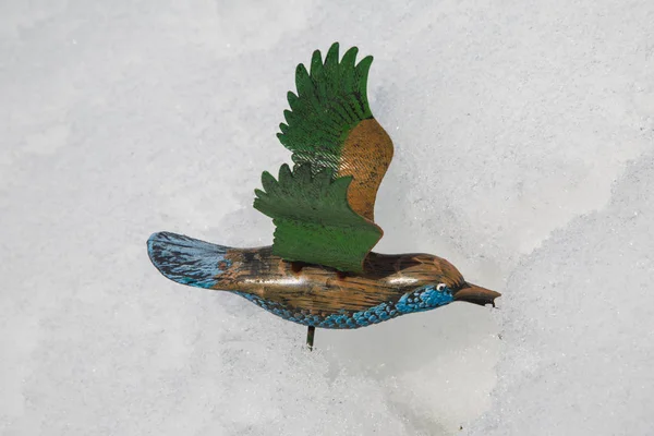 toy bird in the snow