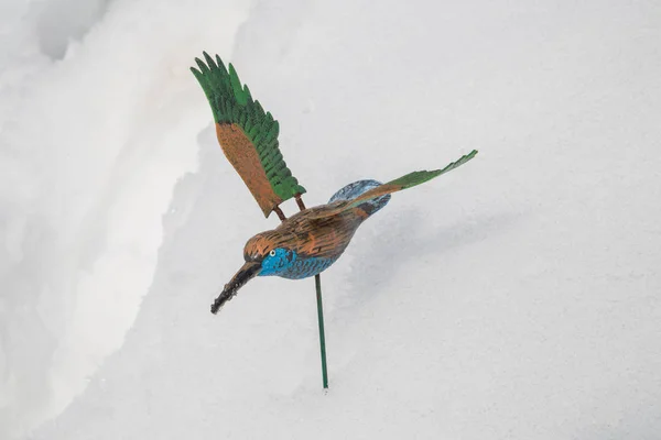 toy bird in the snow