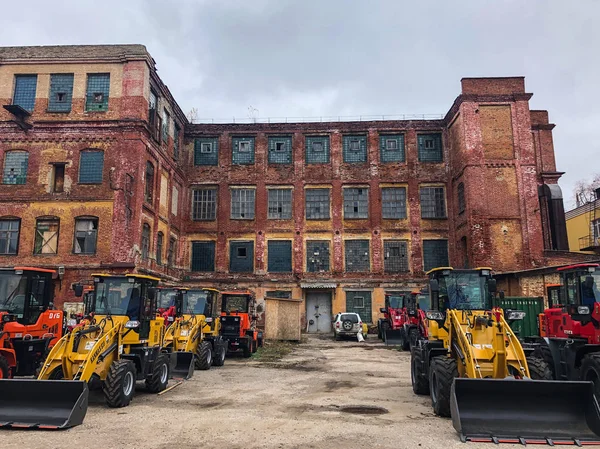 Old Abandoned Factory New Tractors Standing Next — Stock Photo, Image