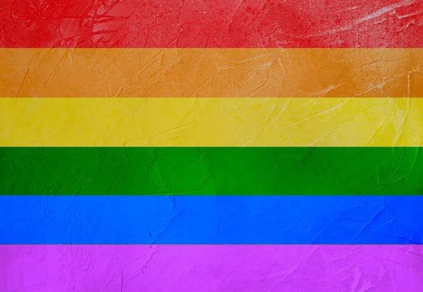 Duvarda kumaşlı LGBT bayrağı var. Gökkuşağı bayrağı. LGBT Gurur Ayı.