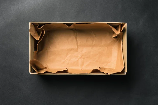 Open Empty Shoe Box Isolated Black Background Crumpled Brown Paper — Stock Photo, Image