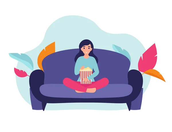 Девушка с попкорном на диване — стоковый вектор