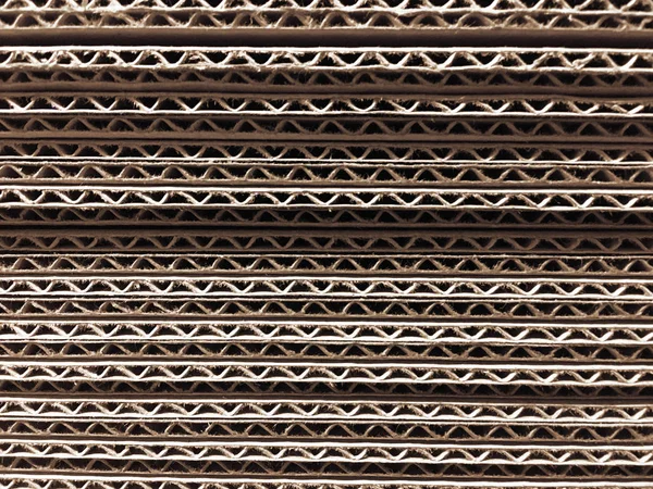 Corrugated cardboard for packing. abstract background horizontal lines with wavy lines of beige color — Stock Photo, Image