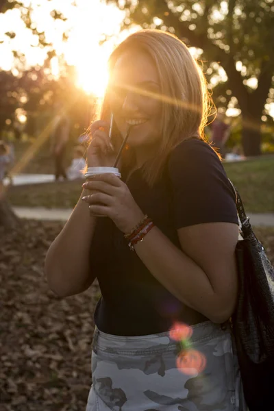 portrait of young attractive woman at sunset