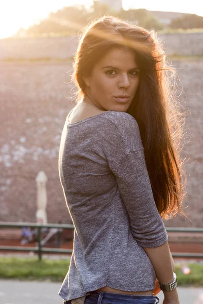 portrait of young attractive woman at sunset