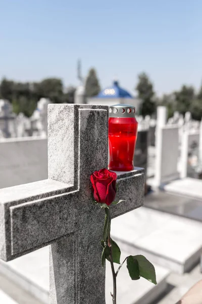 Gravestone with withered rose