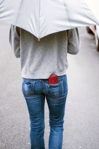 Smartphone in jeans pocket