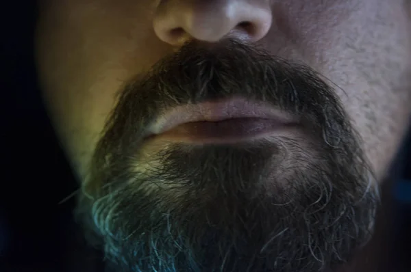 Depressed Man with Beard in Dark Room. Problems, Anxiety, Sadness Concept.