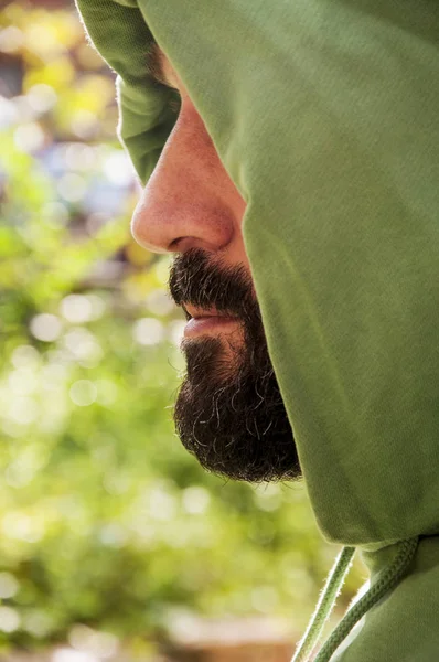 Serious portrait of adult man with hoodie