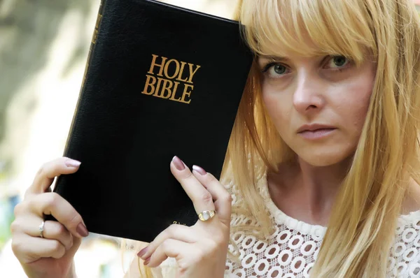 beautiful woman Holding Bible book