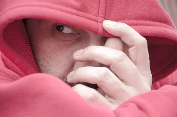 Serious portrait of adult man with hoodie