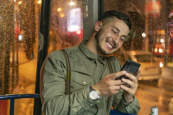 People, lifestyle, travel and public transport. Attractive man in public bus .