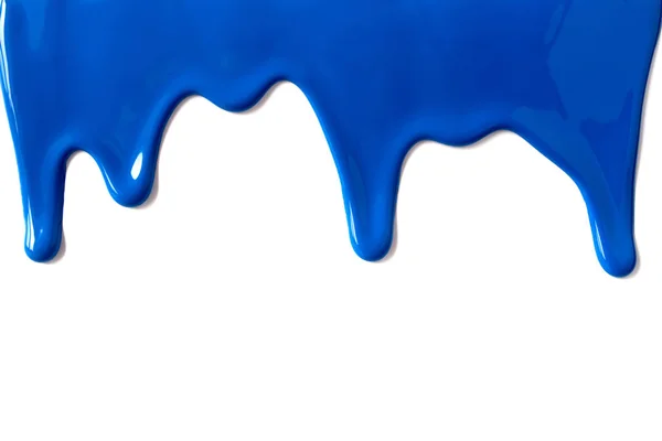 Tinta azul vazando para baixo fundo branco — Fotografia de Stock