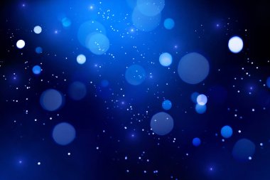 Koyu arka plan üzerinde Mavi soyut bokeh.