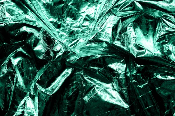 Текстура зім'ятої тканини металевий зелений колір . — стокове фото