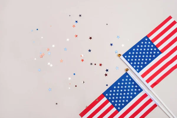 Festive background with US flags and confetti.