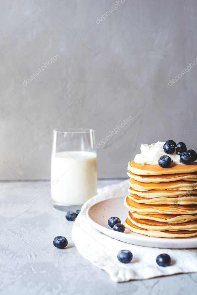 Stack of pancakes with fresh blueberry.