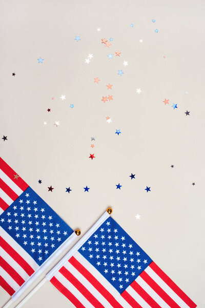 Festive background with US flags and confetti.