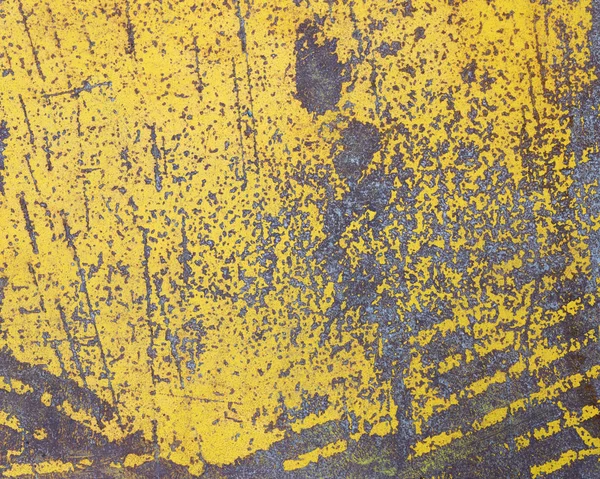 Worn yellow paint on metal sheet texture