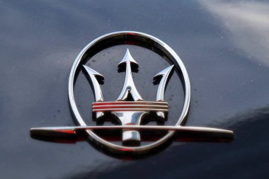 MODENA, ITALY, May 2019 - Motor Valley Fest exhibition, Maserati logo car detail clipart
