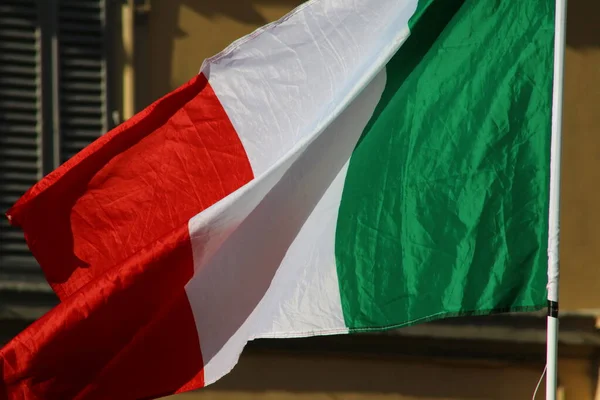 Italian Republic flag in the wind, national symbol, Italy
