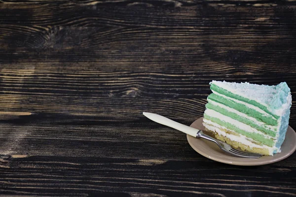 Ombre green cake for the celebration on a dark wooden background. Place for text. — Stock Photo, Image