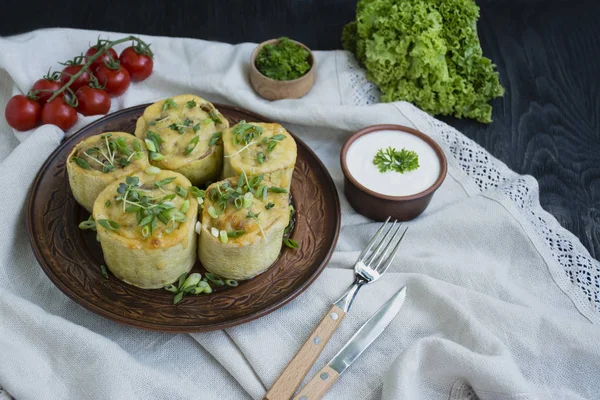 Squash stuffed with minced meat, vegetables and sprinkled with hard cheese. Side view.