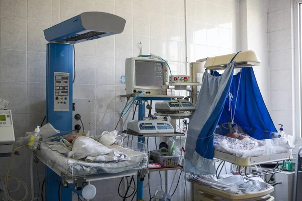 The Neonatal Intensive Care Unit. NICU. The newborn child is connected to devices of artificial vital activity in NICU department