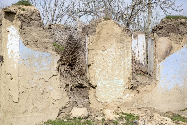 Ruined old house. Ruins of a house made of shell rock, straw and clay in the village. Poor old village.