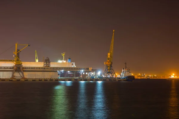 Port terminal of bulk cargo at night time. Industrial port at night