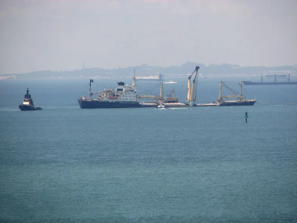 Sinking ship bulk carrier in coastal waters. Bulker sinks due to leaks in the central compartments