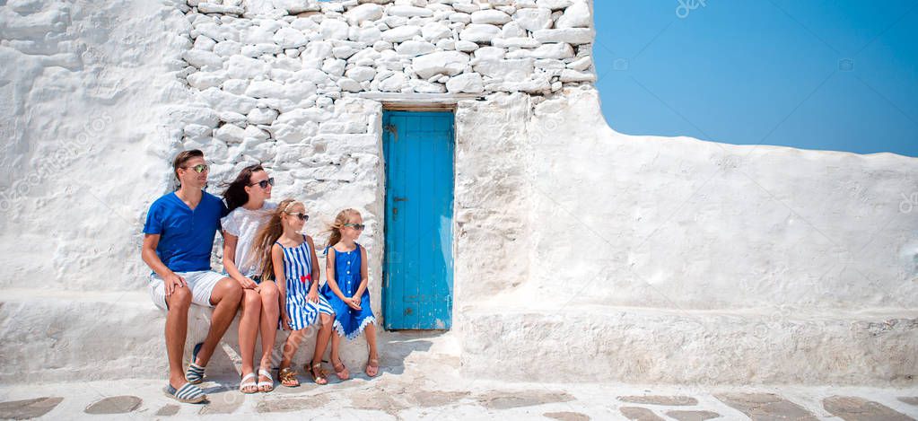 Family having fun outdoors on Mykonos streets